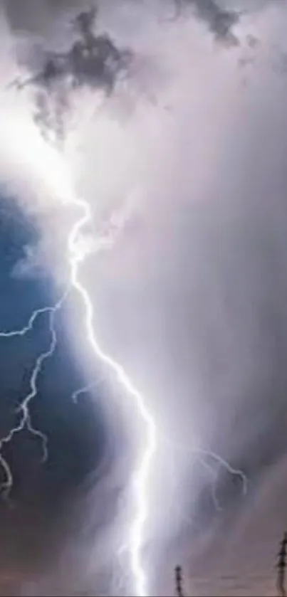 Intense lightning bolt against a cloudy sky.