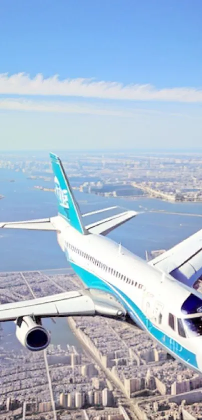 Airplane flying over cityscape with blue sky.