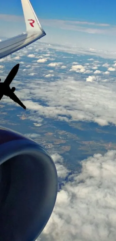 Aerial view from airplane window showing clouds and blue sky.