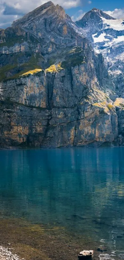 Breathtaking Alpine lake with towering mountains and serene blue water.