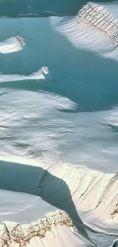 A stunning Arctic ice landscape with snow-covered mountains and a light blue sky.