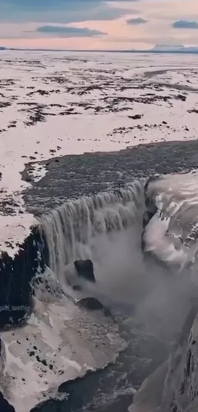 Snow-covered waterfall in Arctic landscape for mobile wallpaper.