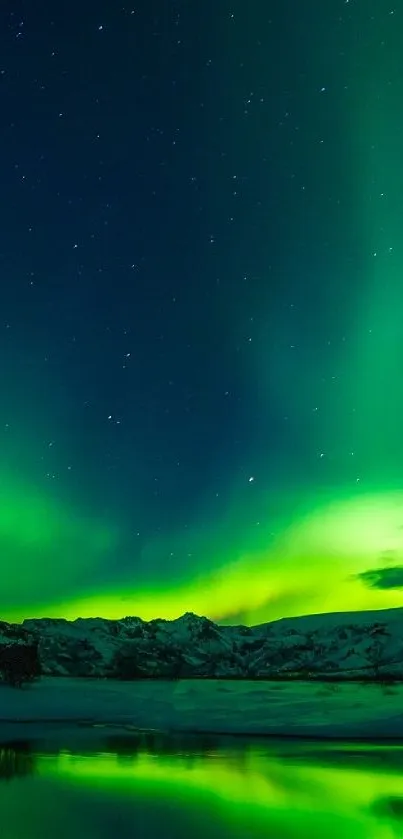 Vibrant Northern Lights aurora illuminates snow-covered mountain landscape.