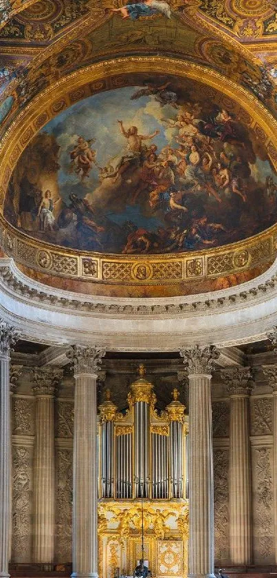 Baroque church interior with elaborate fresco and golden organ.