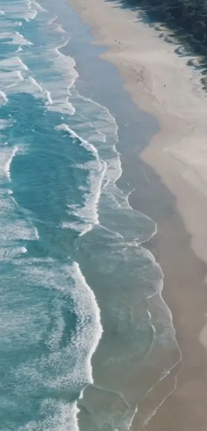 Aerial view of a beach with turquoise waves and sandy shores.