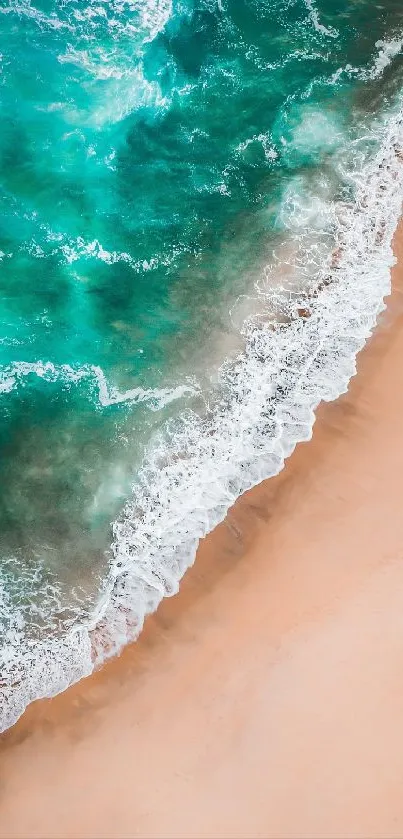 Aerial view of a pristine beach with turquoise waves.