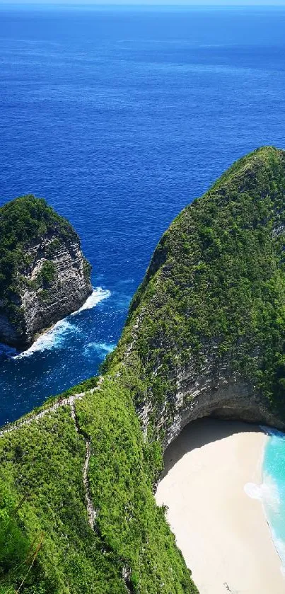 Beautiful beach with vibrant blue ocean and lush green cliffs.