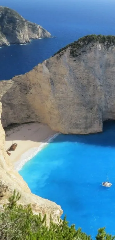 Mobile wallpaper of a beach with blue ocean and cliffs.