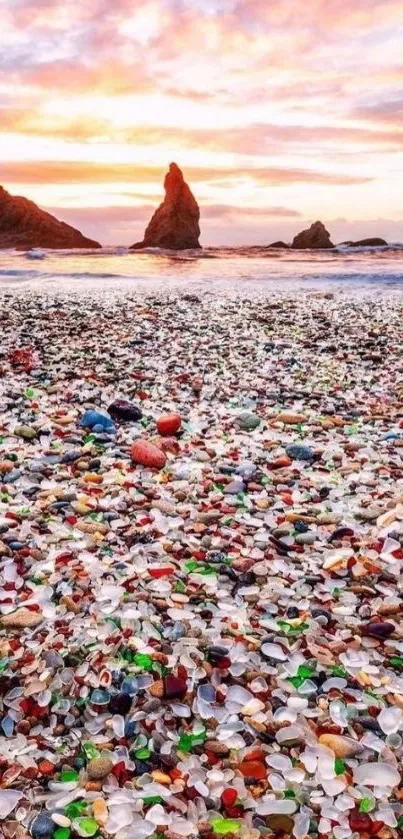 Beach covered in colorful glass with a stunning sunset background.