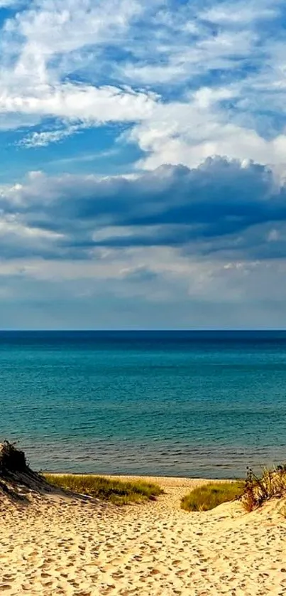 Beach with ocean view and blue sky wallpaper.