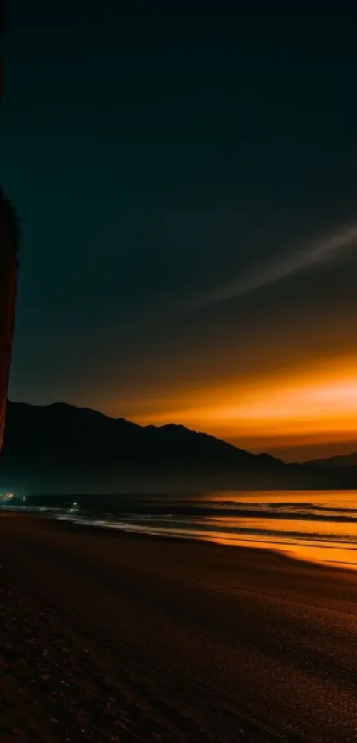 Stunning sunset over a tranquil beach with vivid orange and dark tones.