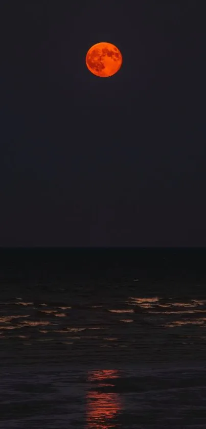 Blood moon reflecting over ocean at night
