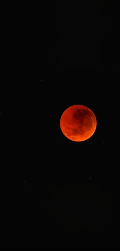 Red blood moon on dark starry background mobile wallpaper.