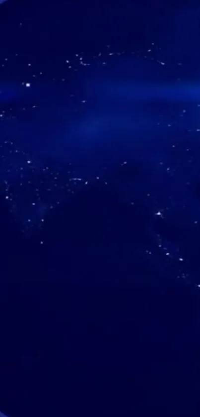 A high-resolution image of Earth illuminated at night with city lights in deep blue tones.