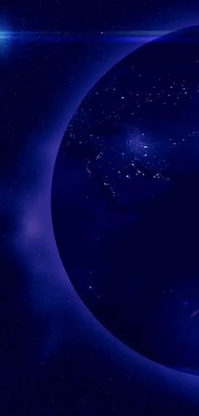 Blue Earth glowing in night sky with stars as wallpaper.