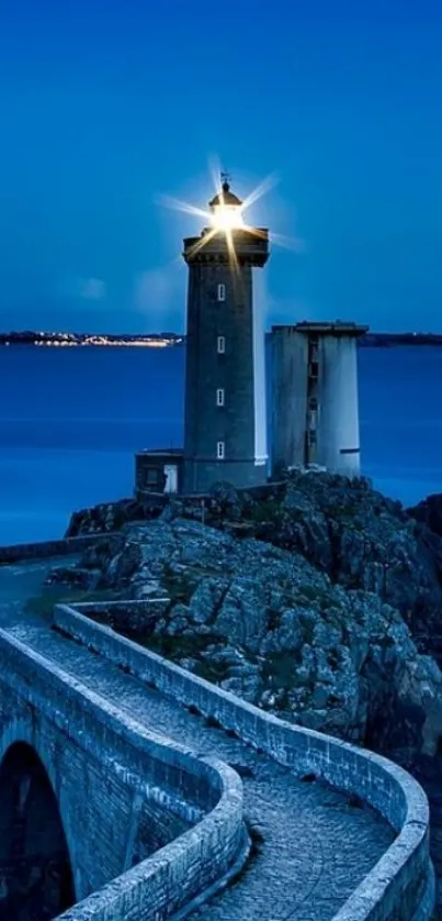 Scenic lighthouse at dusk with ocean view.