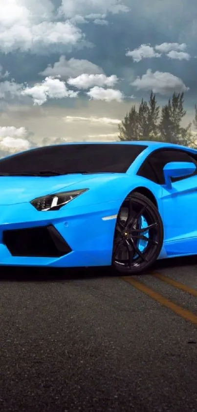 Striking blue sports car on a scenic road with clouds.