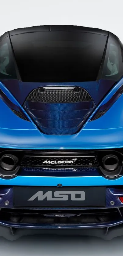 Rear view of a sleek blue sports car with aerodynamic design and vibrant color.