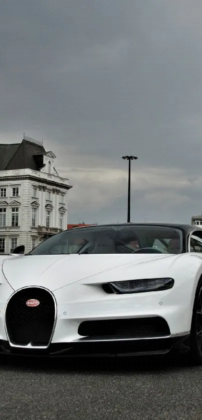 Bugatti Chiron car on a city road with cloudy skies.