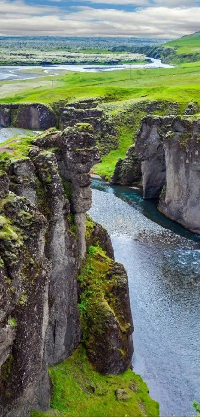 A vibrant canyon landscape with lush greenery and a flowing river.