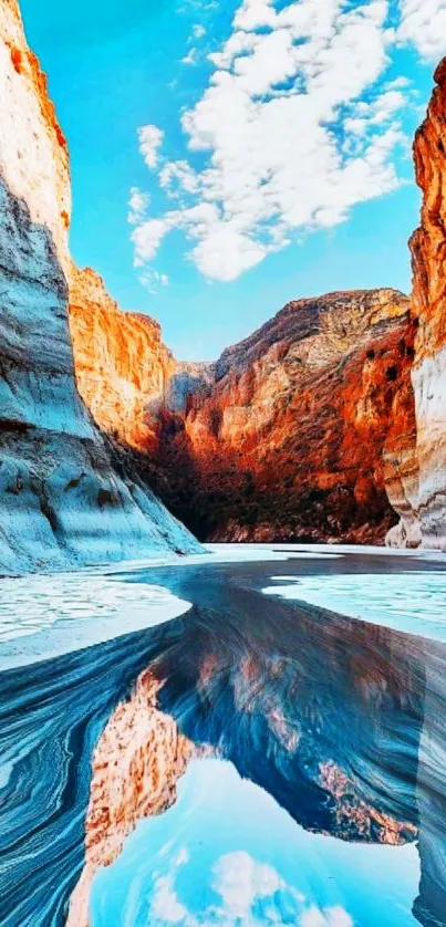 Canyon with vivid colors and serene water reflections under a clear sky.