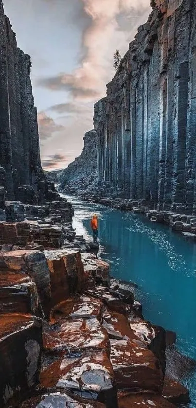 Canyon with turquoise river and towering cliffs.