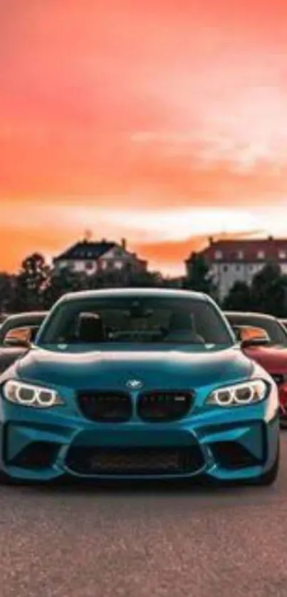 Cars lined up under a vibrant orange sunset sky.