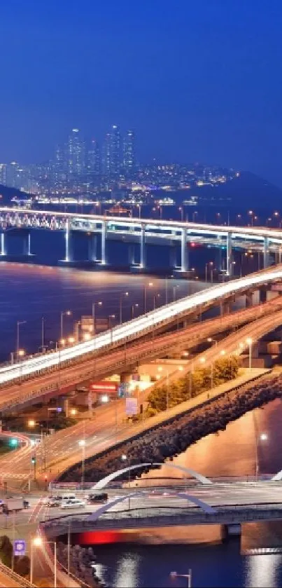 Beautiful city skyline and bridge at night.