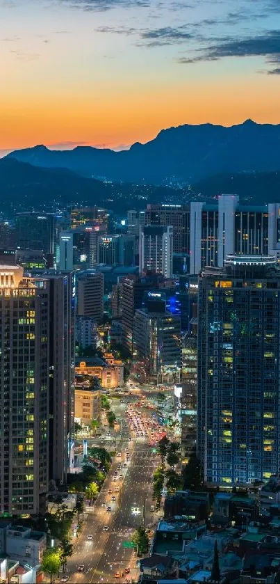 Cityscape at dusk with vibrant lights and sunset.