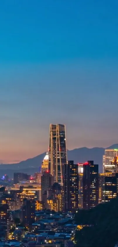 Beautiful cityscape at dusk with sparkling city lights against a twilight sky.