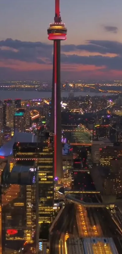City skyline at night with vibrant urban lights and skyscrapers.