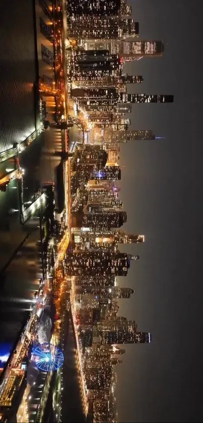 Night cityscape with glowing skyscrapers and riverside lights.