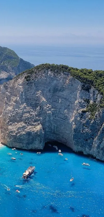 Stunning azure cliffside beach wallpaper with towering cliffs and blue waters.