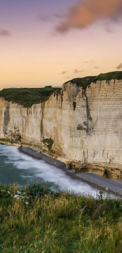 Majestic cliffs meeting the ocean during sunset, offering a serene natural view.