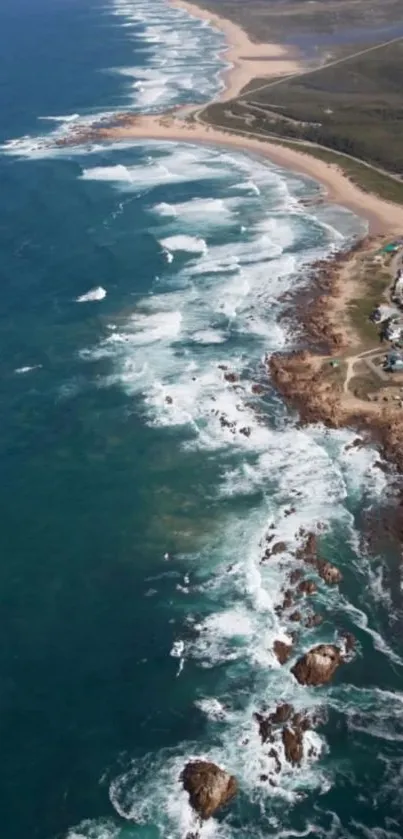 Aerial view of a stunning coastline with waves crashing on the shore.