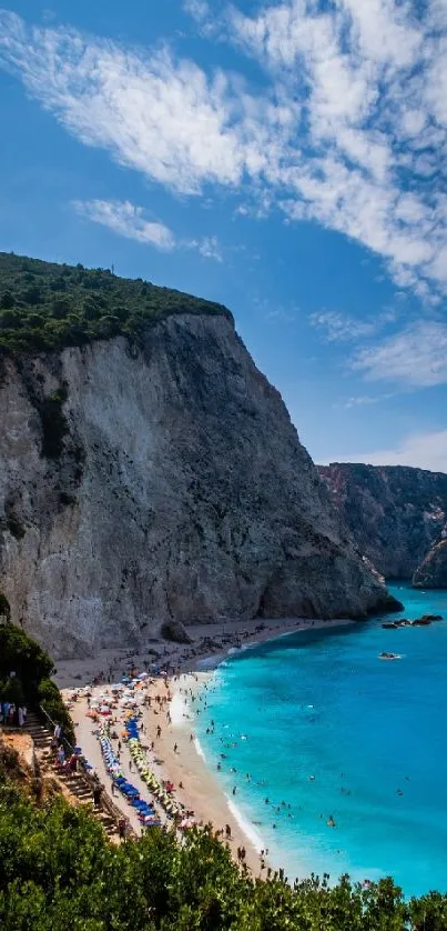 Breathtaking coastal beach with azure waters and a towering cliff under blue skies.