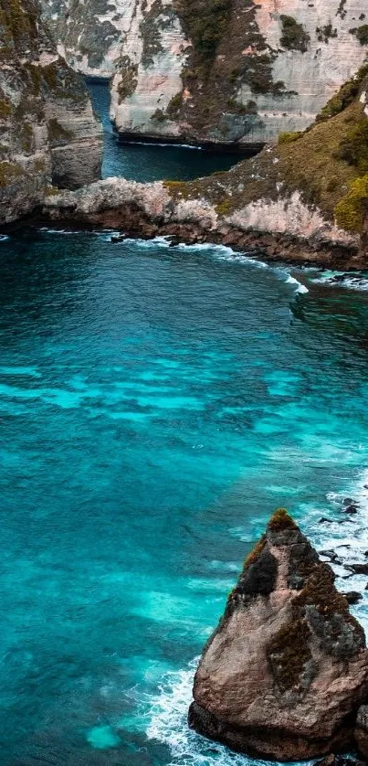 Scenic coastal beach with cliffs and vibrant turquoise water.