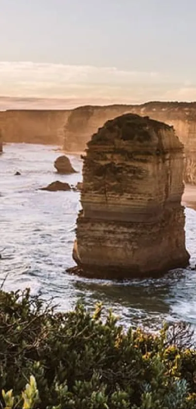 Stunning view of coastal cliffs and ocean waves at sunrise.