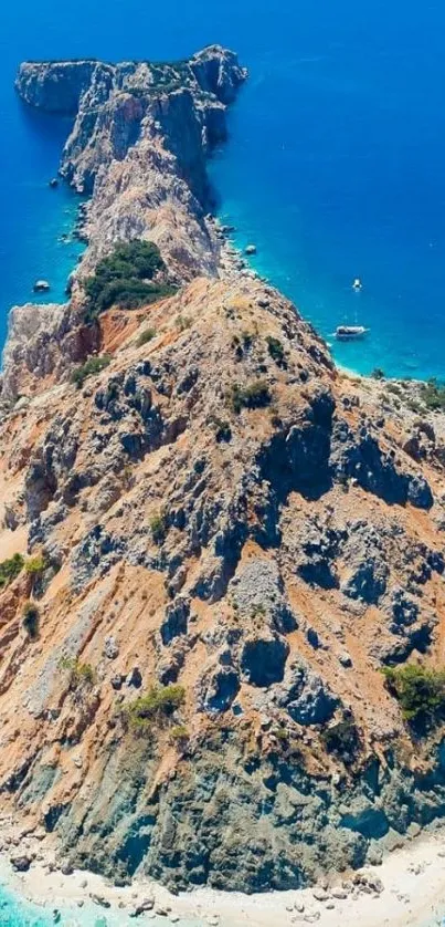 A stunning aerial view of an island with turquoise waters and a rocky coastline.