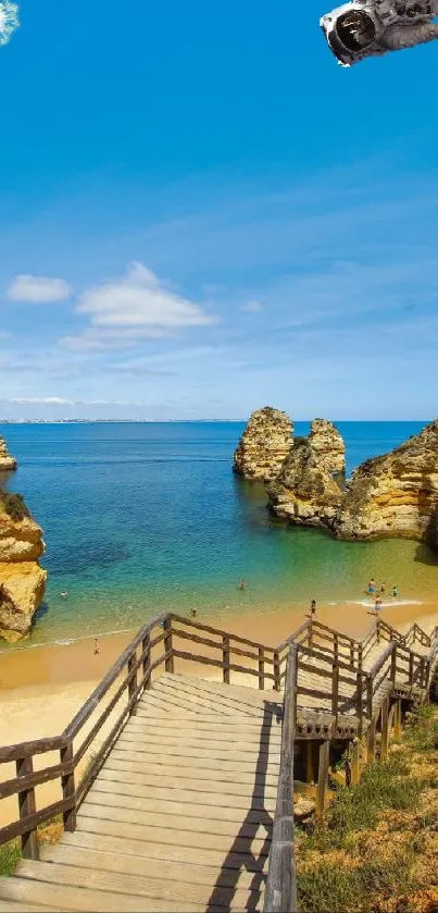 Beach cliffscape with ocean and wooden stairs.