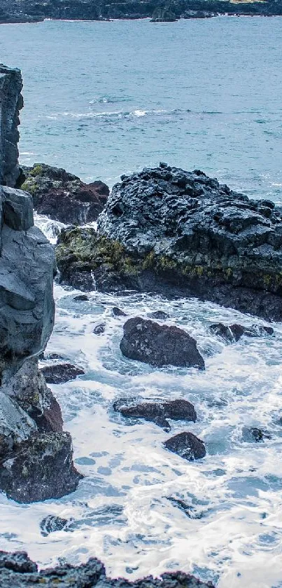 Rugged coastal rocks with waves crashing.