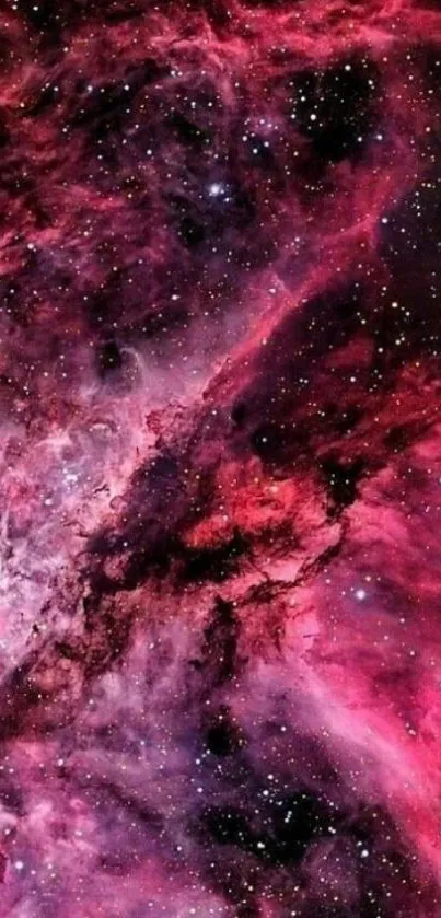 Vibrant pink and purple cosmic nebula wallpaper.