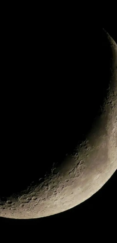 Crescent moon on black background wallpaper.