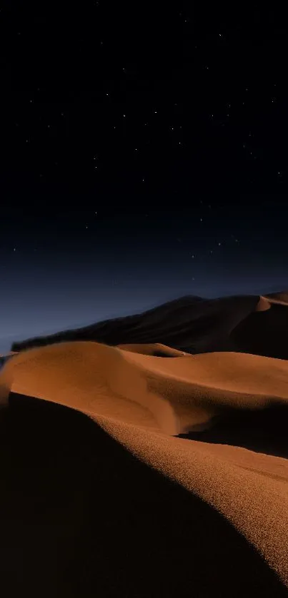 Starry night over desert dunes with dark blue sky.