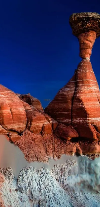 Majestic desert rock formation with deep blue sky backdrop.