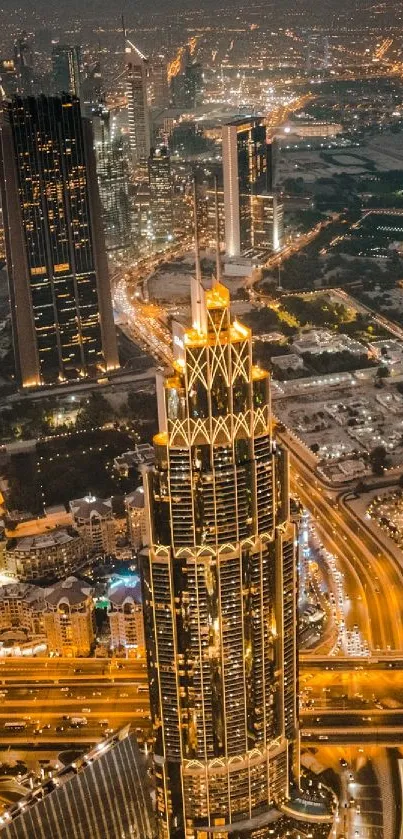 Aerial view of Dubai skyline at night, featuring illuminated skyscrapers.