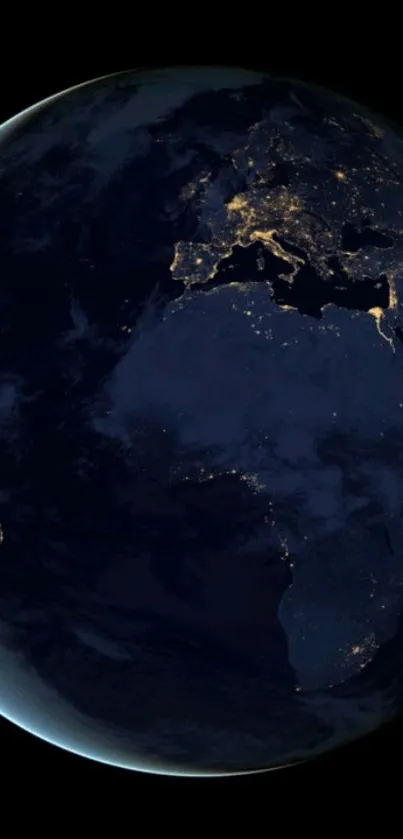 View of Earth at night from space with glowing city lights.