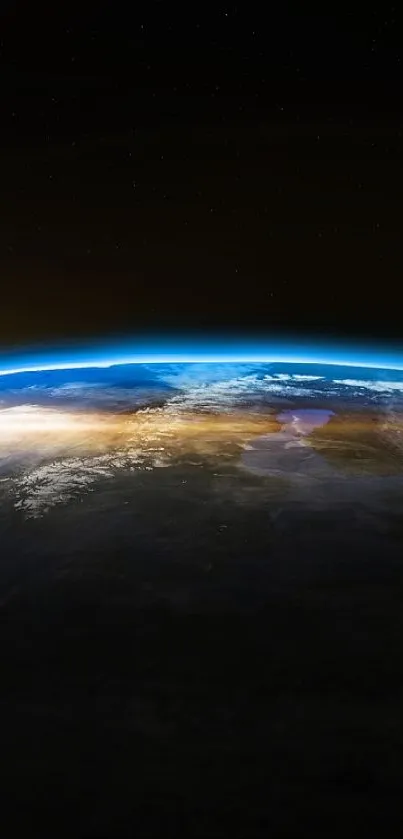 View of Earth from space with a sunrise on the horizon and moon visible in the backdrop.