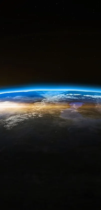 Earth from space at sunrise with a crescent moon in view.