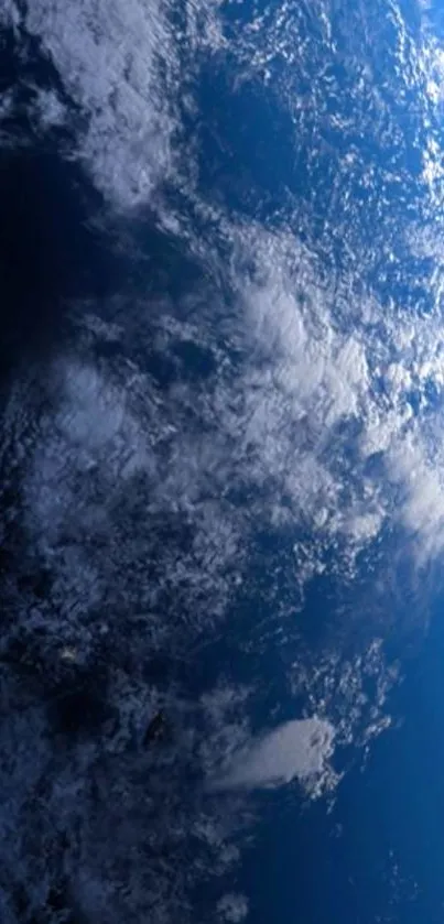 Striking view of Earth from space with blue oceans and swirling white clouds.